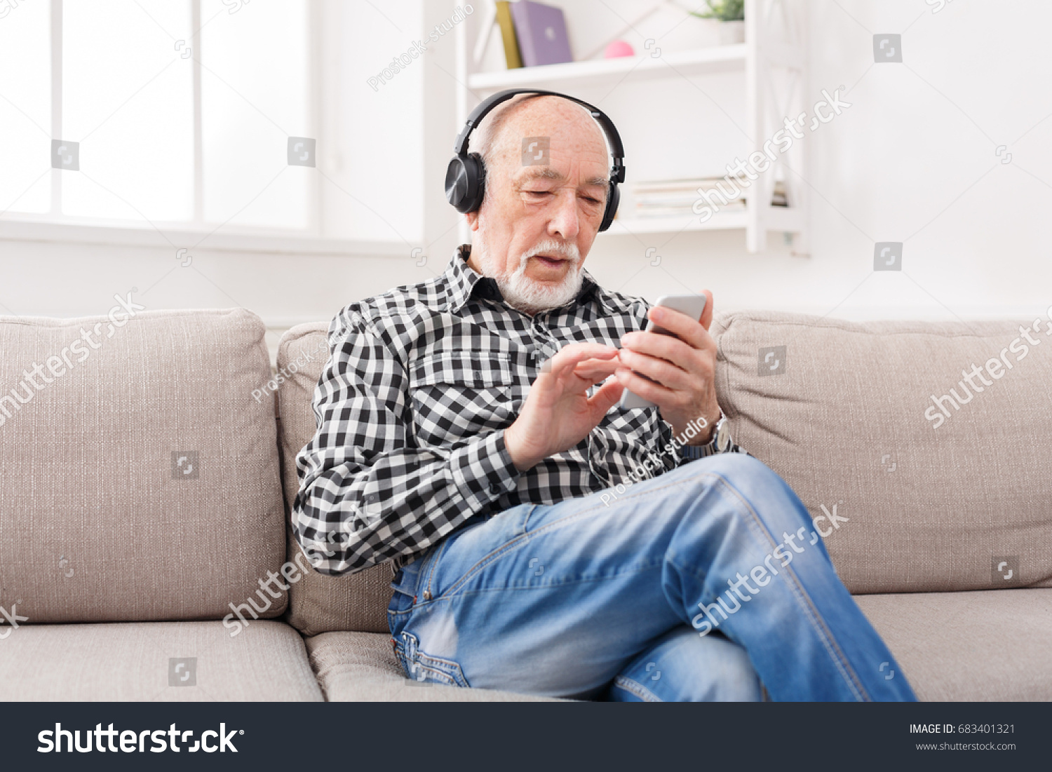 Senior Man Listening Music On Smartphone Stock Photo 683401321 ...