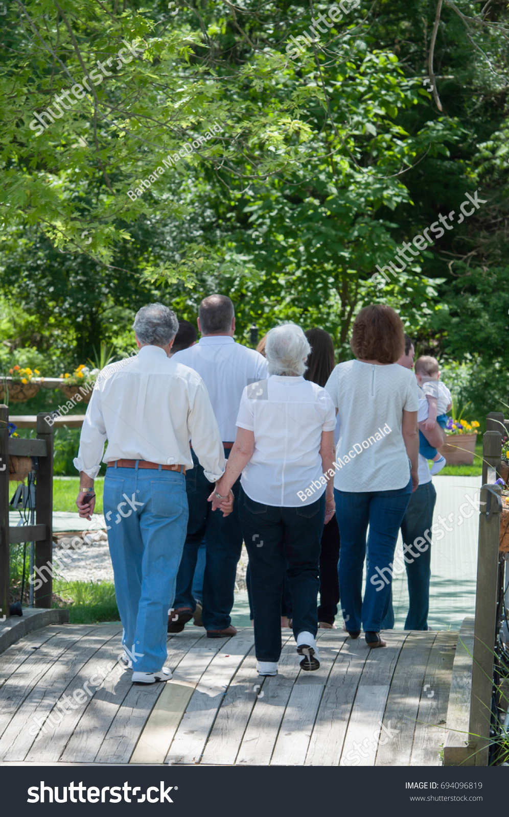 Group People Walking Together Holding Hands Stock Photo 694096819 ...