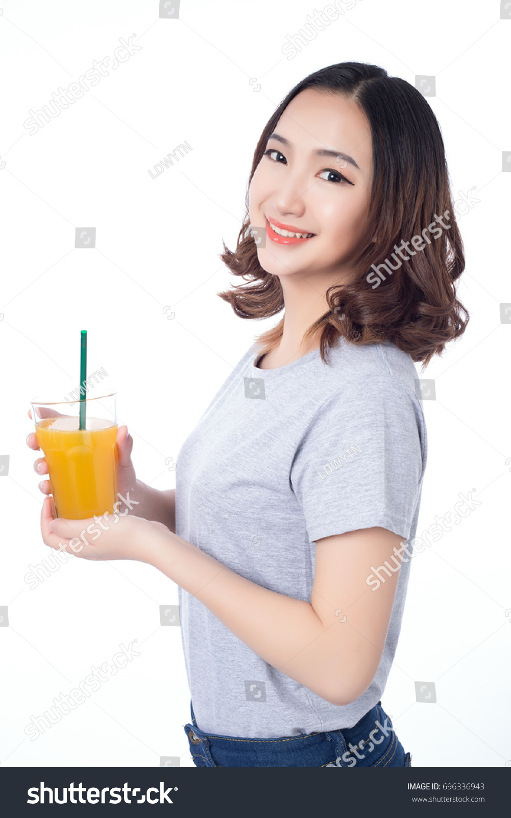 Young Woman Drinking Orange Juice Stock Photo 696336943 | Shutterstock