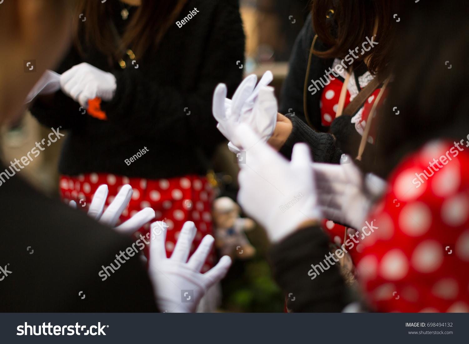 wearing white gloves