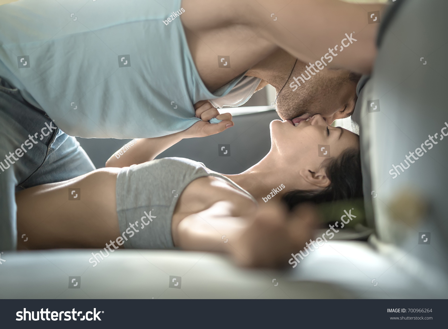 Girls Kissing On Sofa