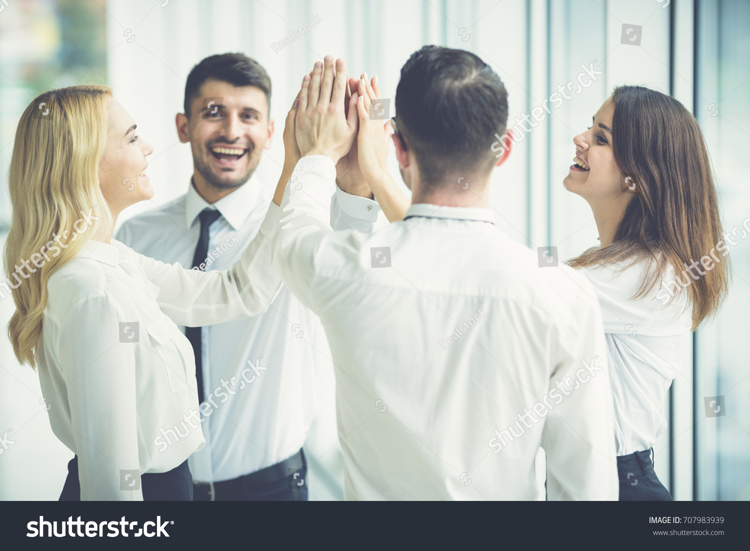 Happy Business People Greeting High Five Stock Photo 707983939 ...