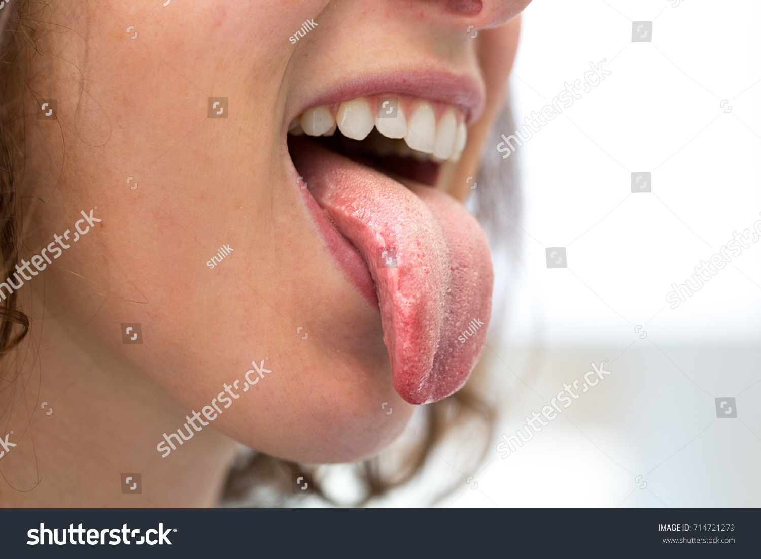 Фото с языком название. The girl shows her tongue.