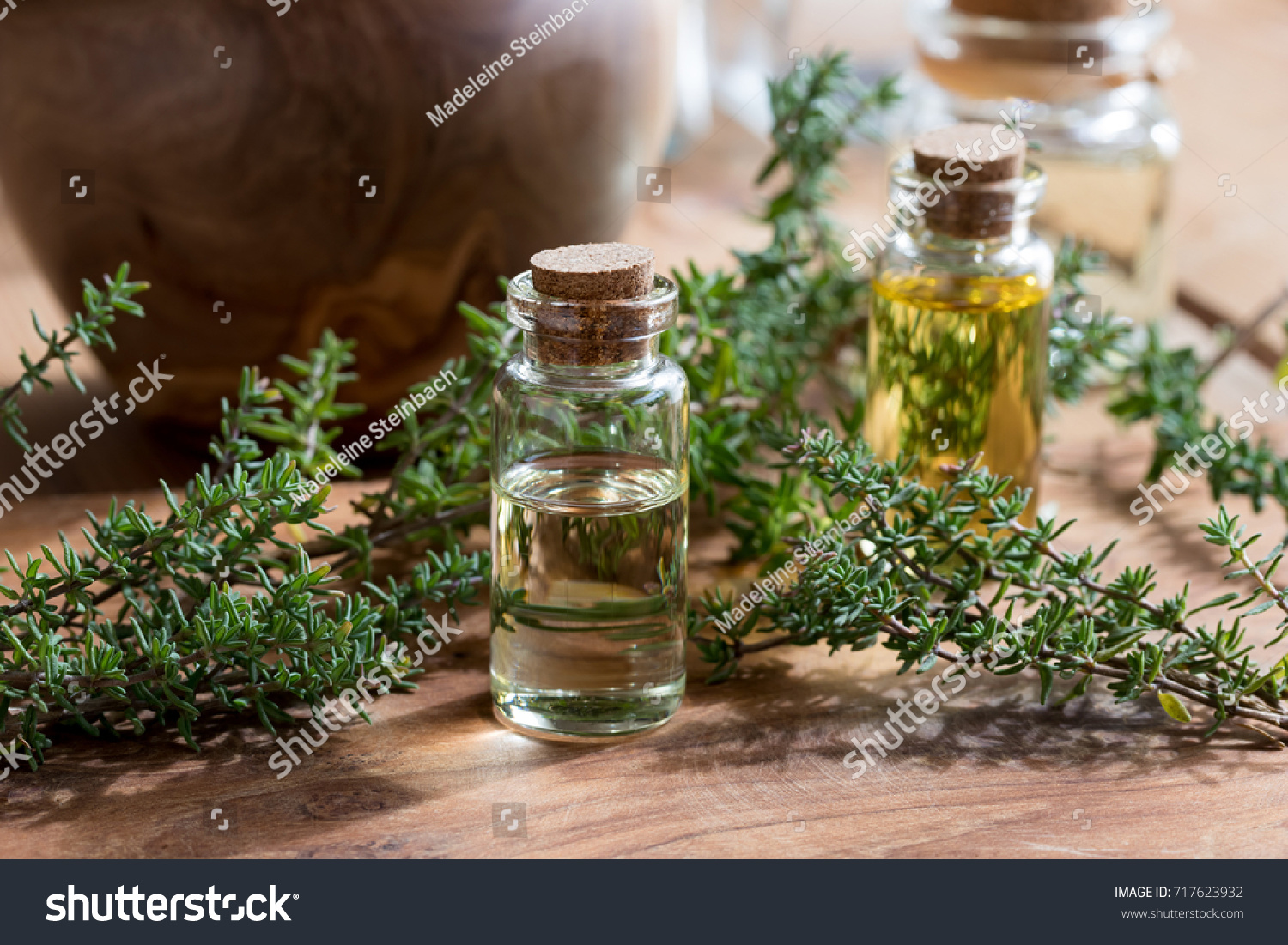 41 678 Thyme And Oil Images Stock Photos Vectors Shutterstock   Stock Photo A Bottle Of Thyme Essential Oil With Fresh Thyme Twigs And Other Bottles In The Background 717623932 