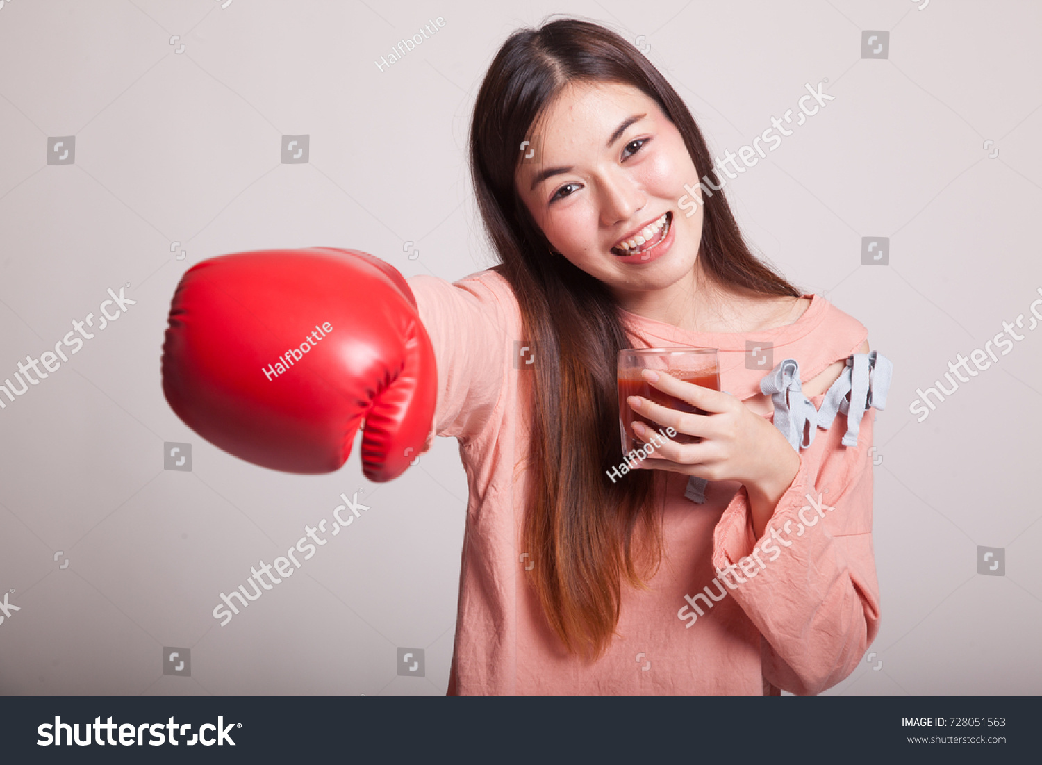 Стоковая фотография 728051563: Young Asian Woman Tomato Juice Boxing Shutte...