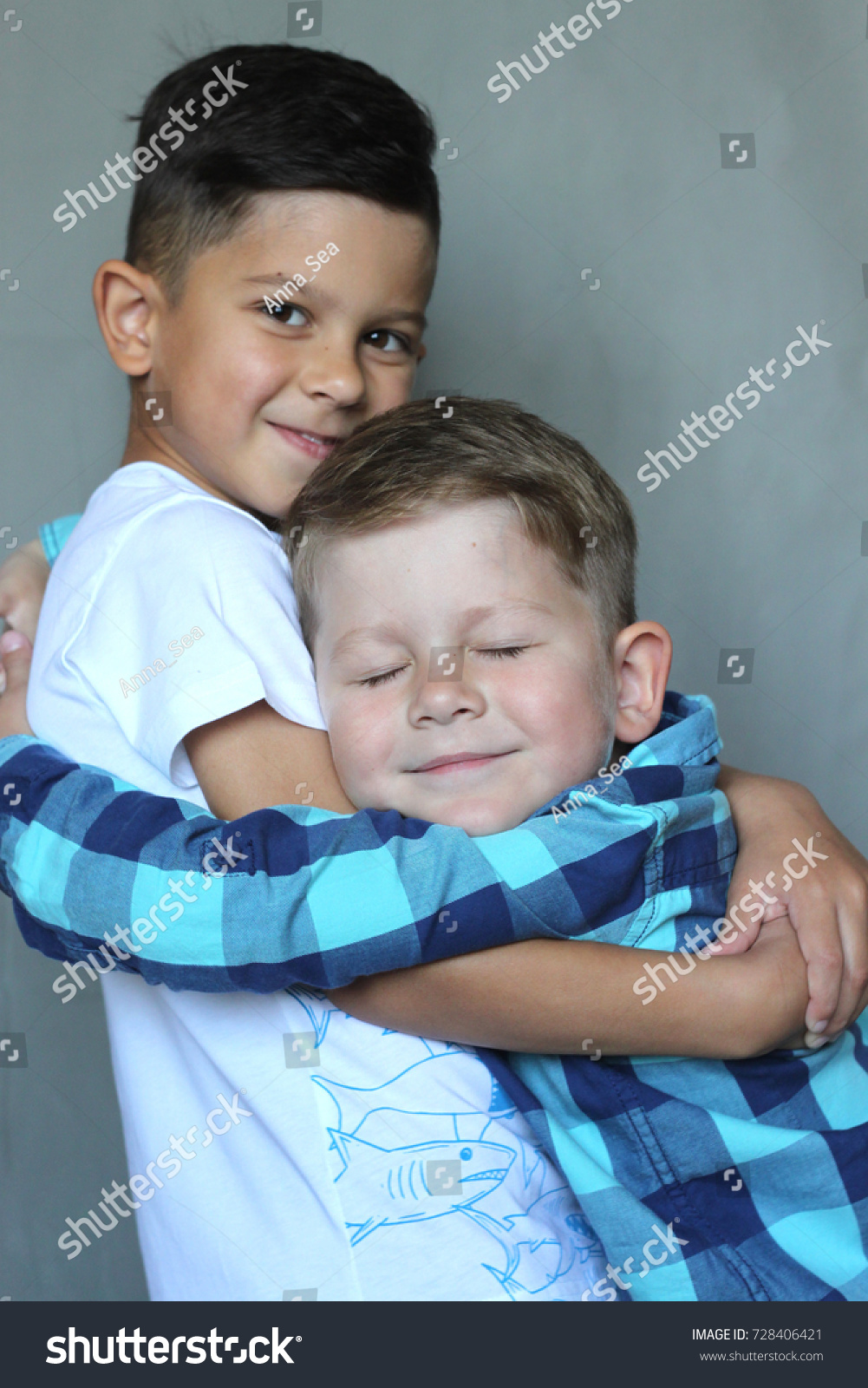 young boys hugging