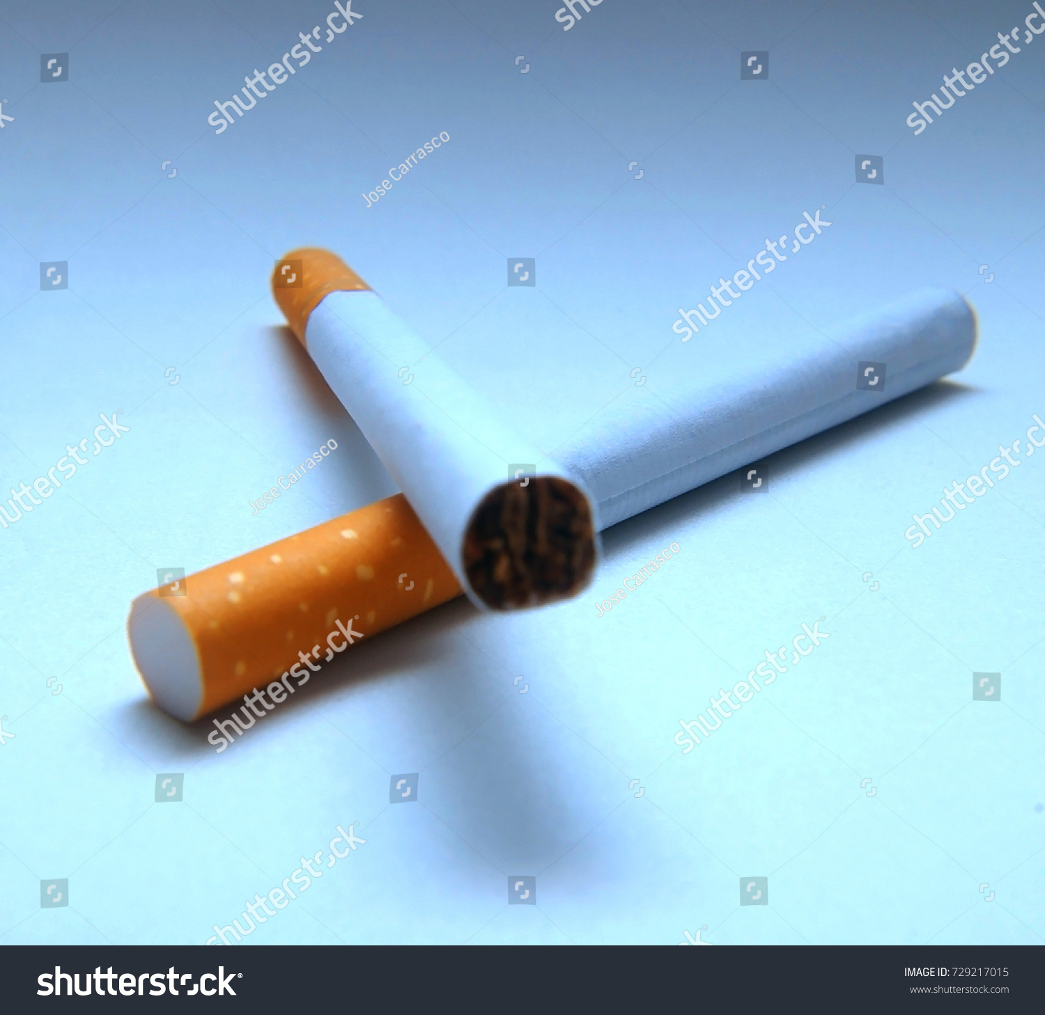 Two Cigarettes Blue Background Stock Photo 729217015 | Shutterstock