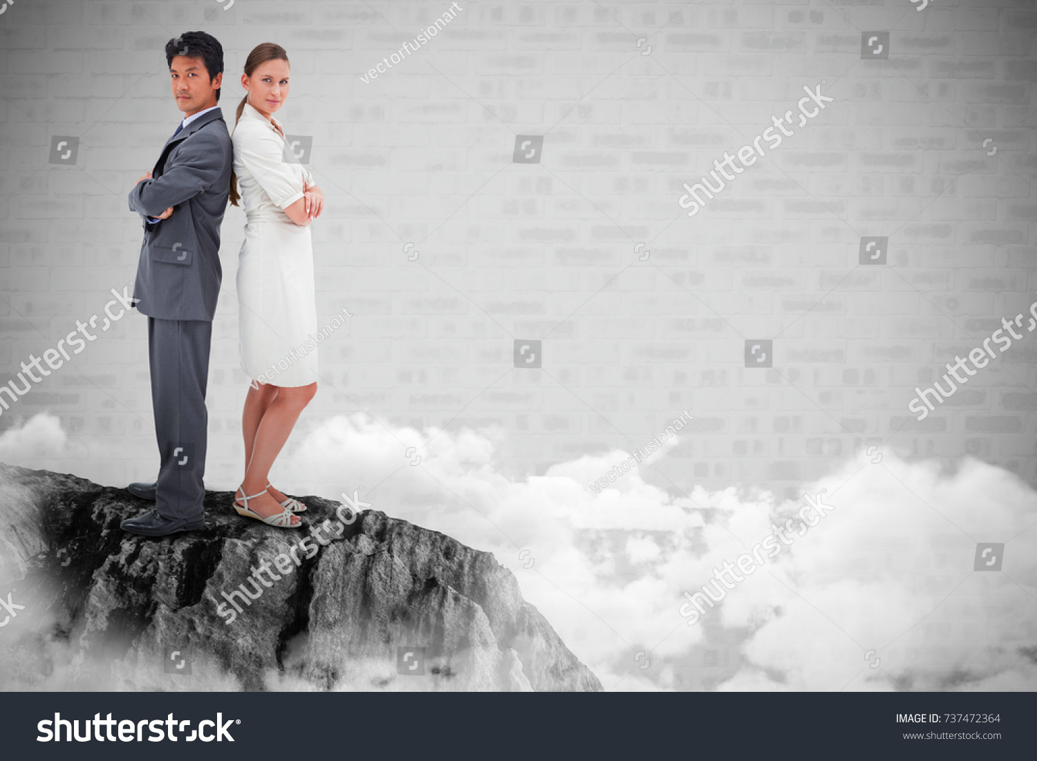 portrait-business-people-standing-backtoback-against-stock-photo-737472364-shutterstock