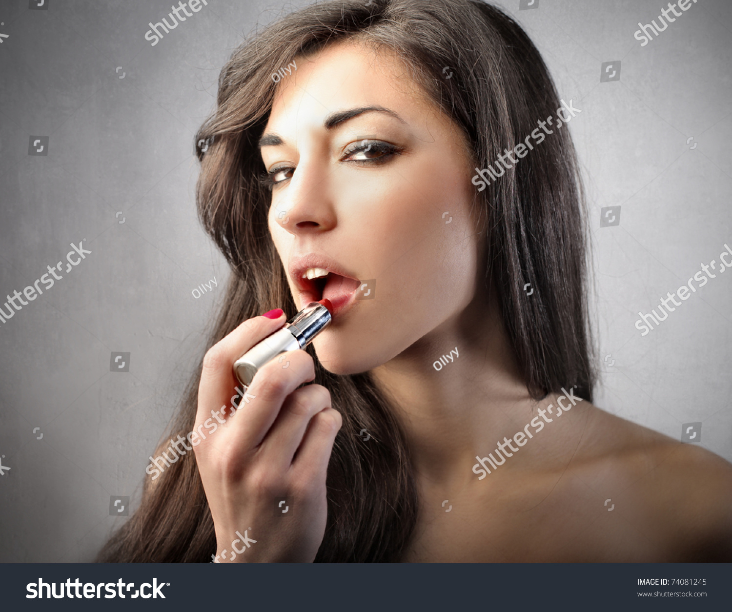 putting on lipstick