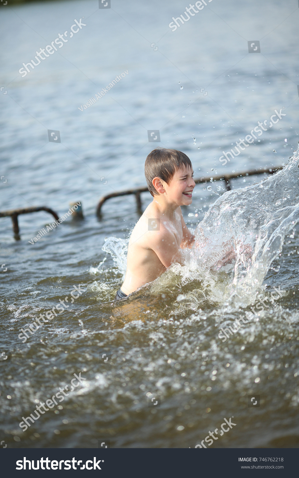 boy swimming in river