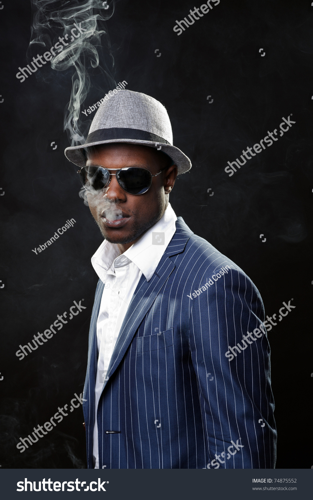 black man in suit and hat