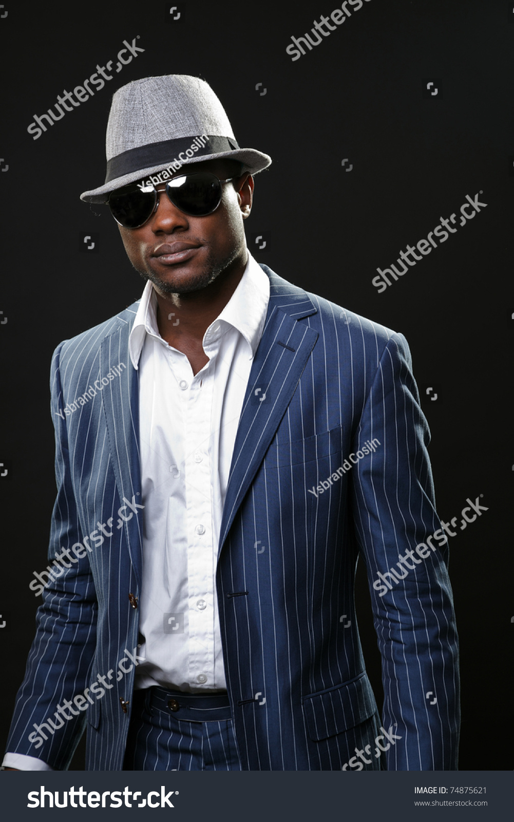 black man in suit and hat