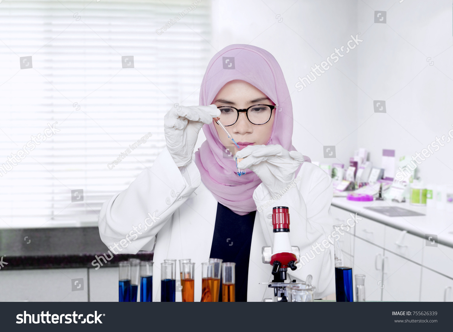 Female Muslim Researcher Makes Experiment Sample Stock Photo 755626339 ...