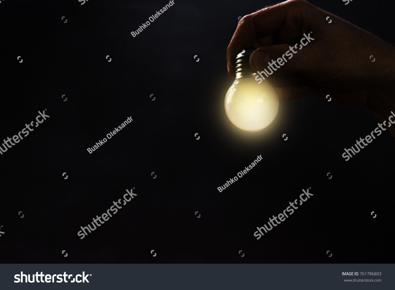 Hand Holding Light Bulb Fingers Blackboard Stock Photo 761786803 ...