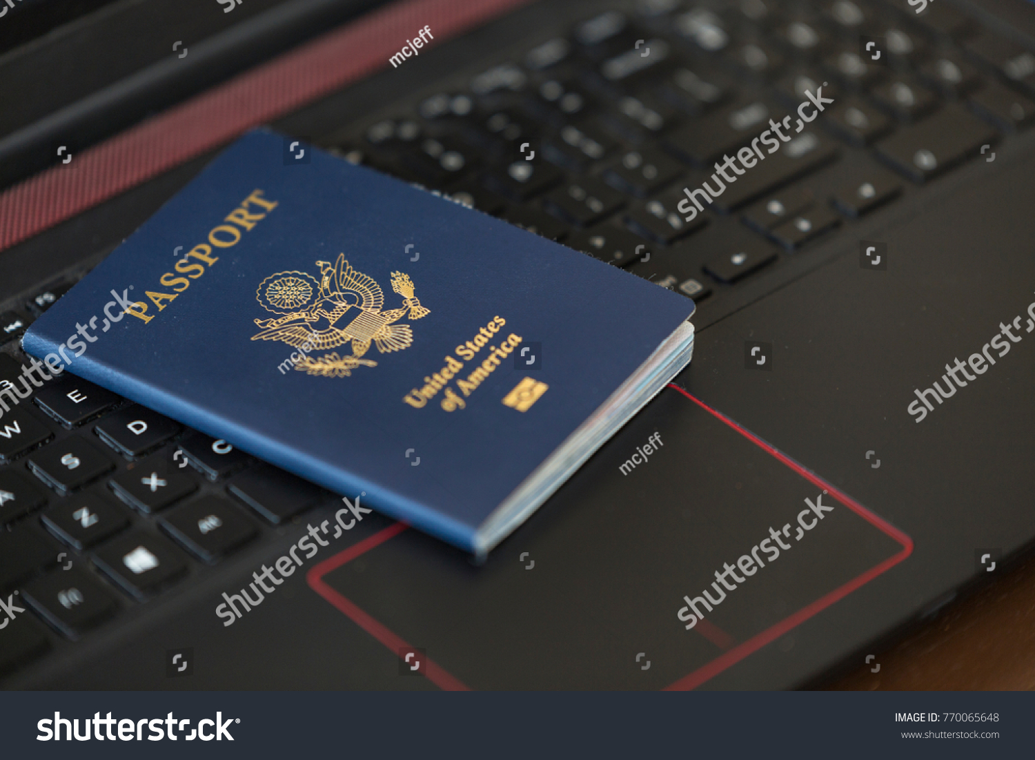 american-passport-laying-on-black-passport-stock-photo-770065648