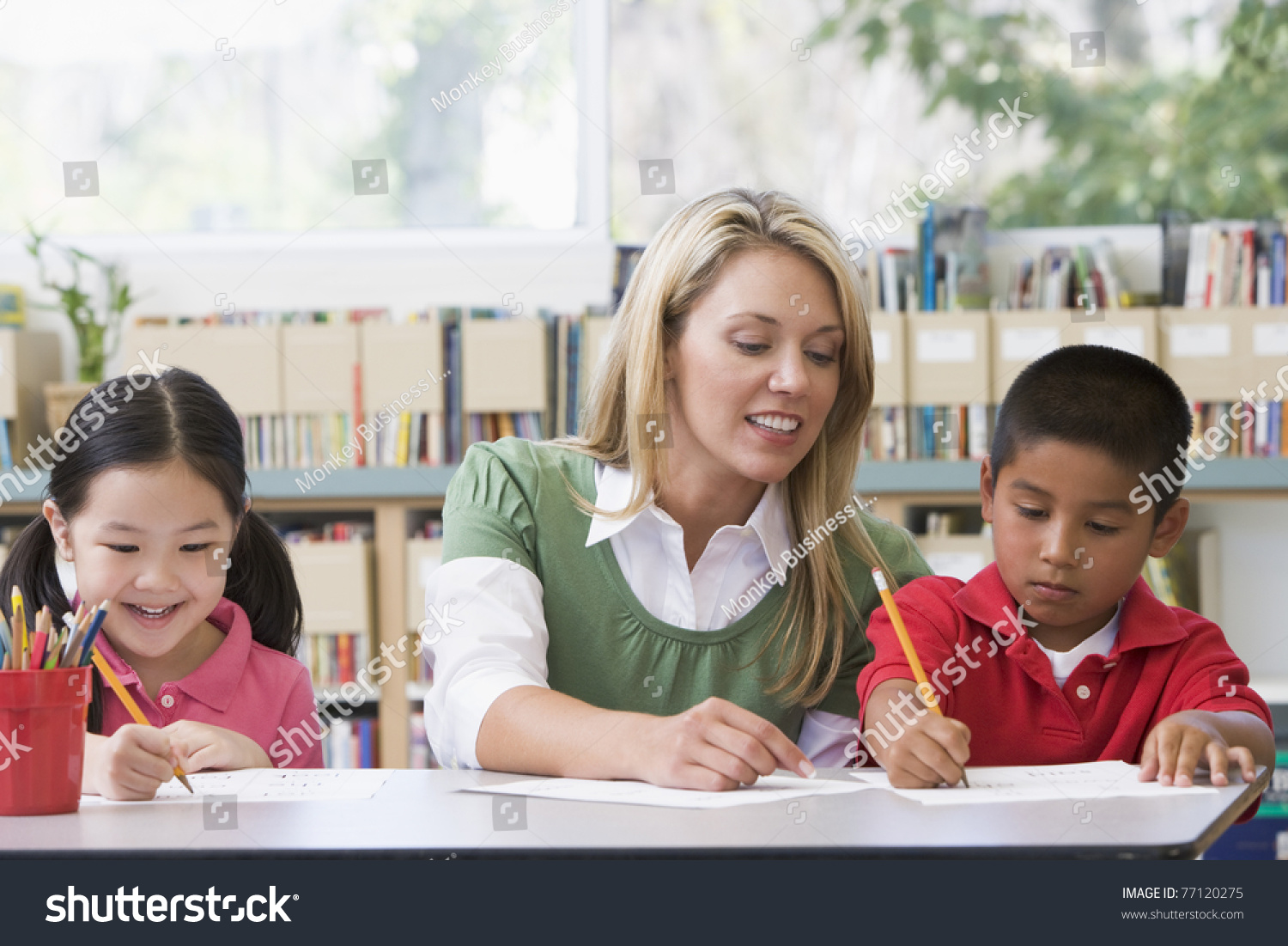 Two Students Class Writing Teacher Helping Stock Photo 77120275 ...