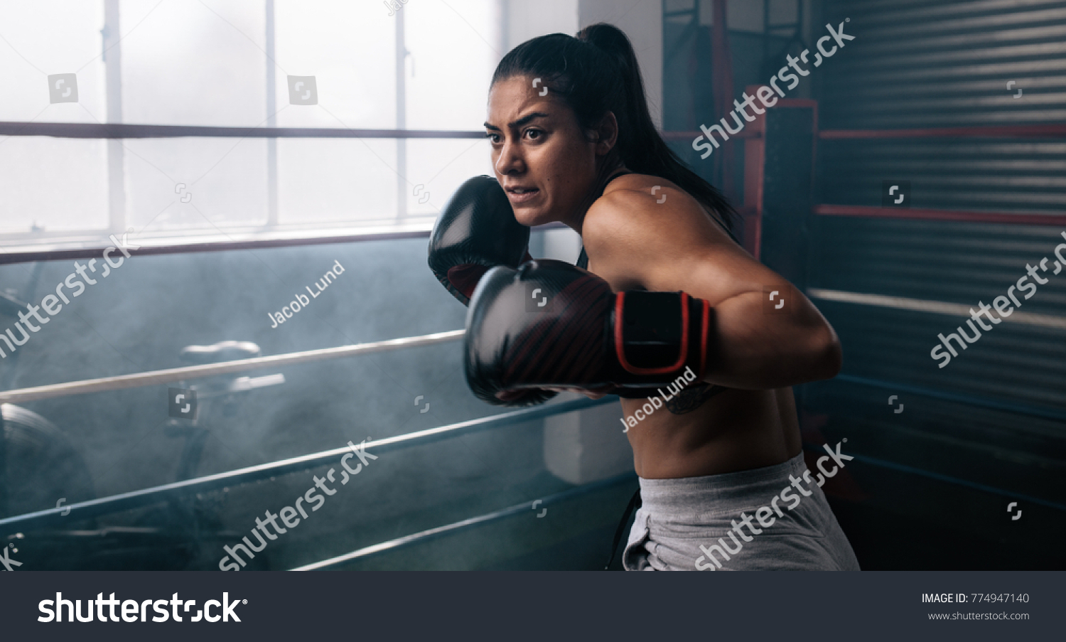 Female Boxer Doing Shadow Boxing Inside Stock Photo 774947140 