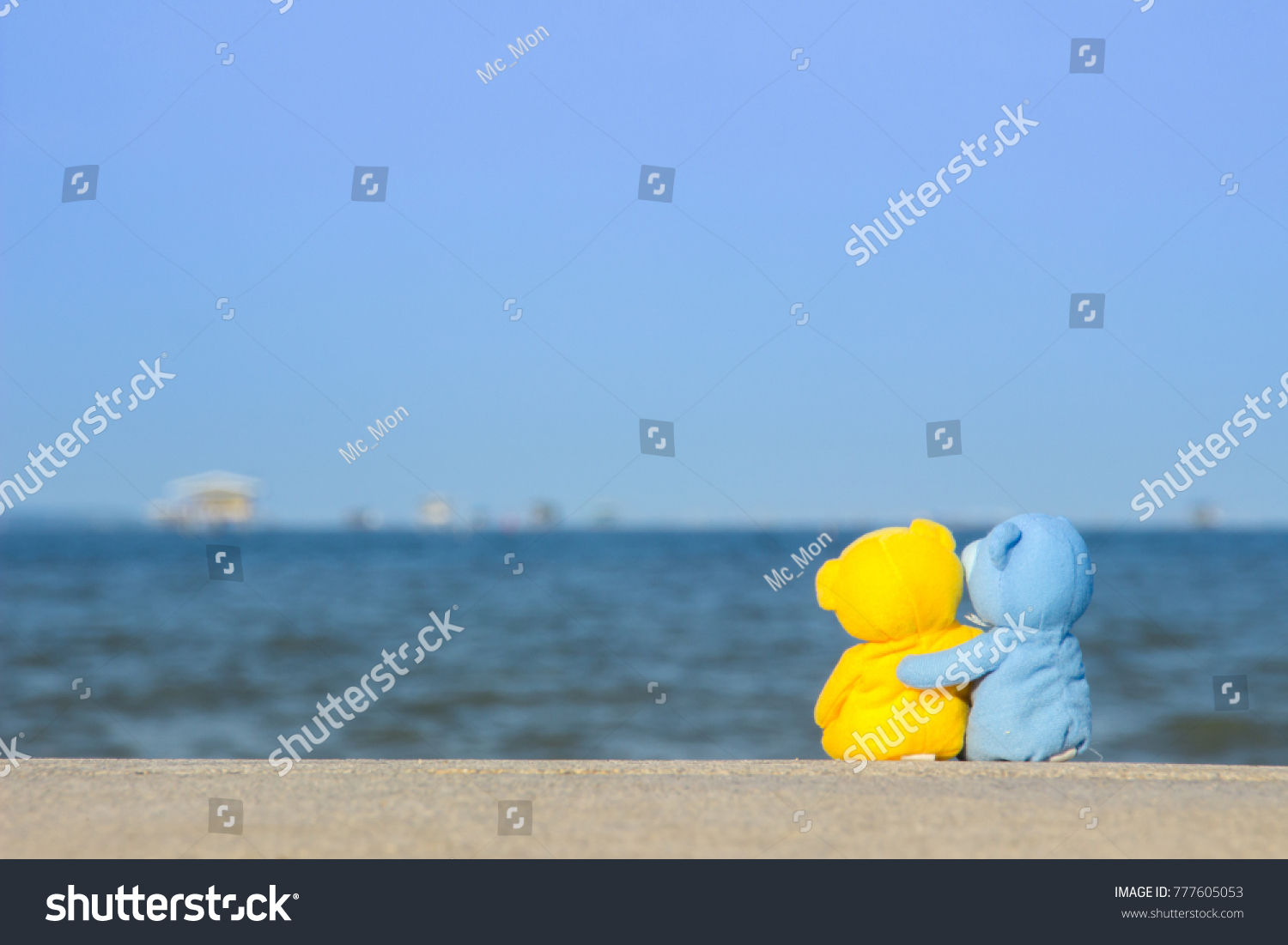 yellow with blue teddy bear