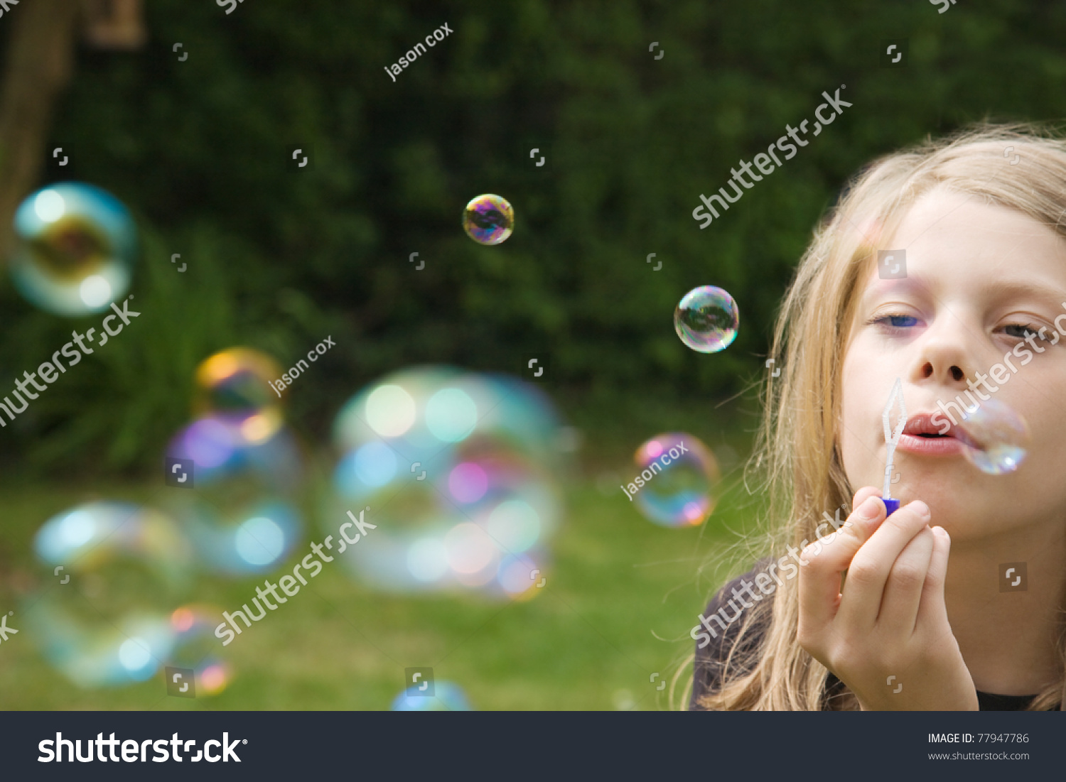 Young Girl Blowing Bubbles Stock Photo 77947786 | Shutterstock