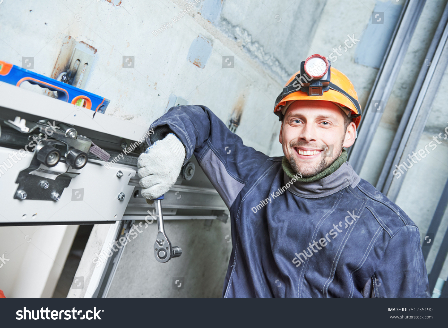 Smiling Machinist Spanner Adjusting Lift Elevator Stock Photo 781236190 ...