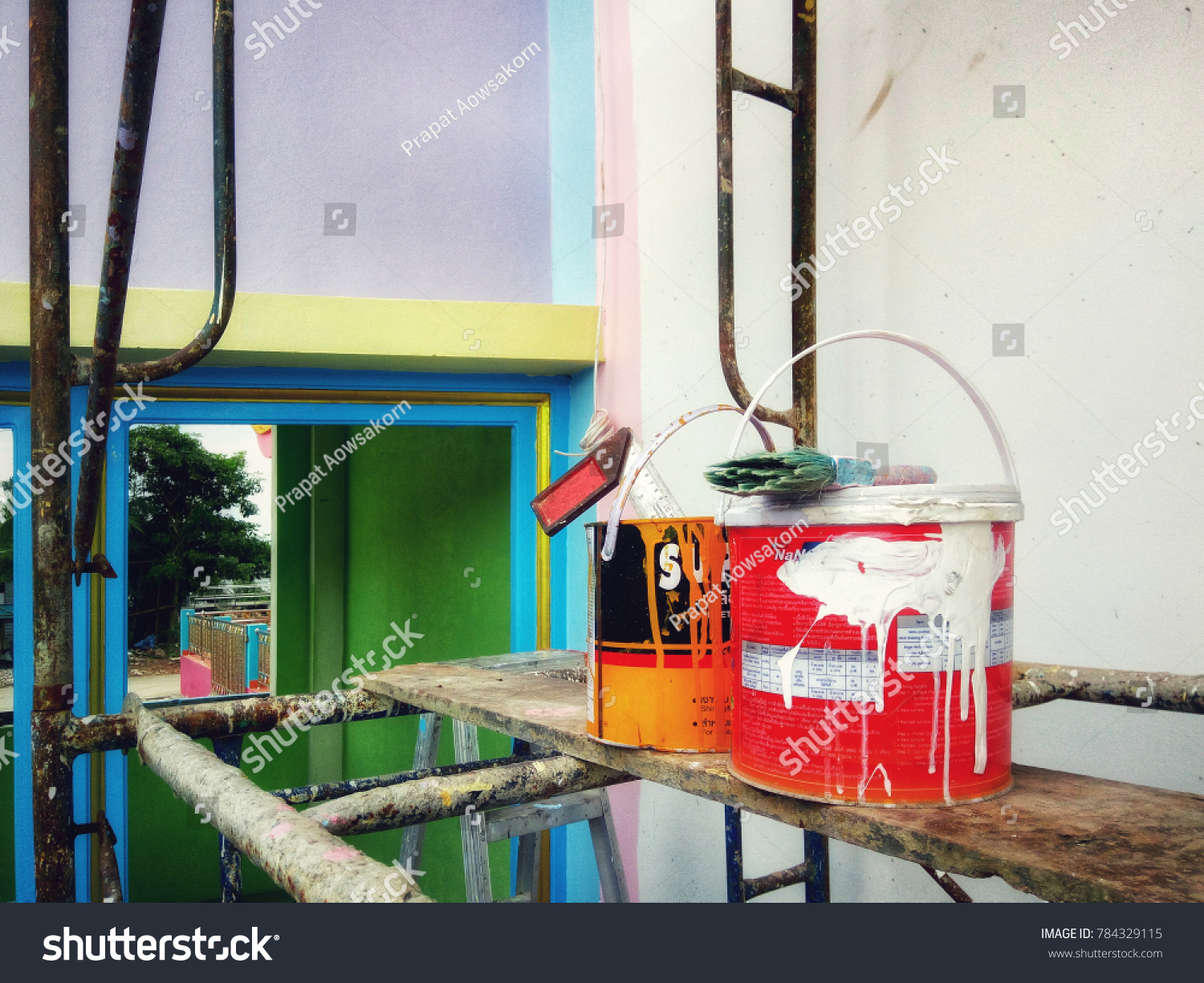 Paint Cans Equipment On Scaffolding Painting Stock Photo 784329115   Stock Photo Paint Cans And Equipment On Scaffolding For Painting The Wall In Construction 784329115 