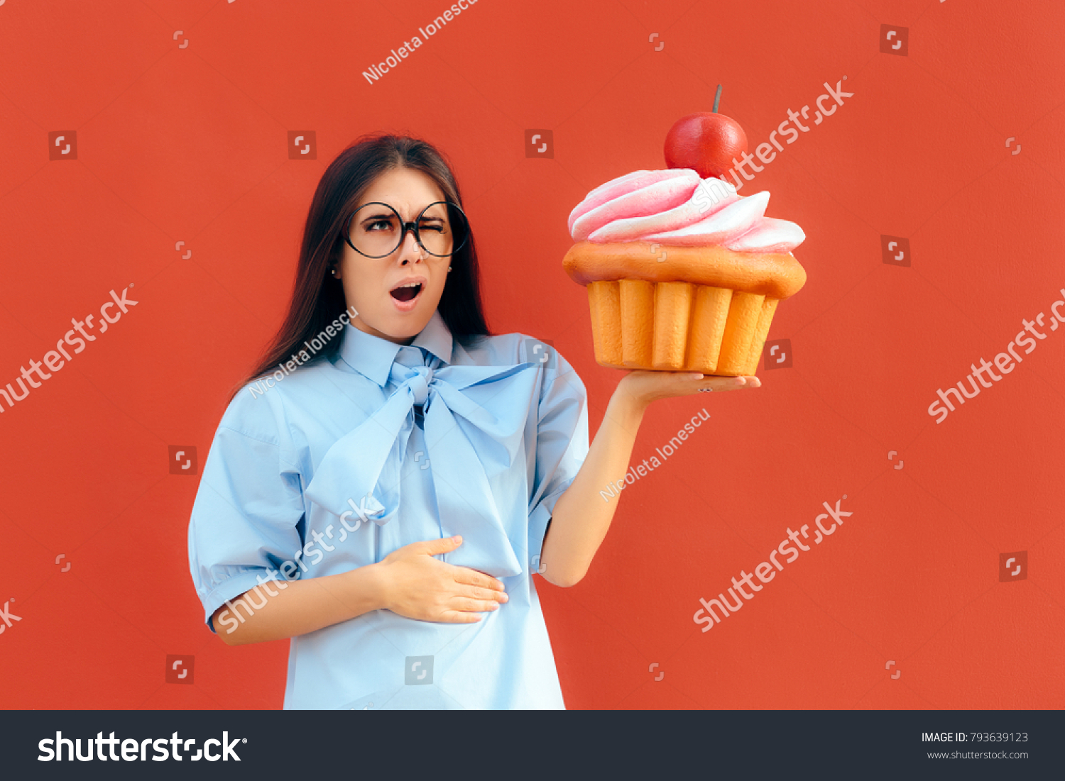 woman-suffering-stomach-ache-after-eating-stock-photo-793639123