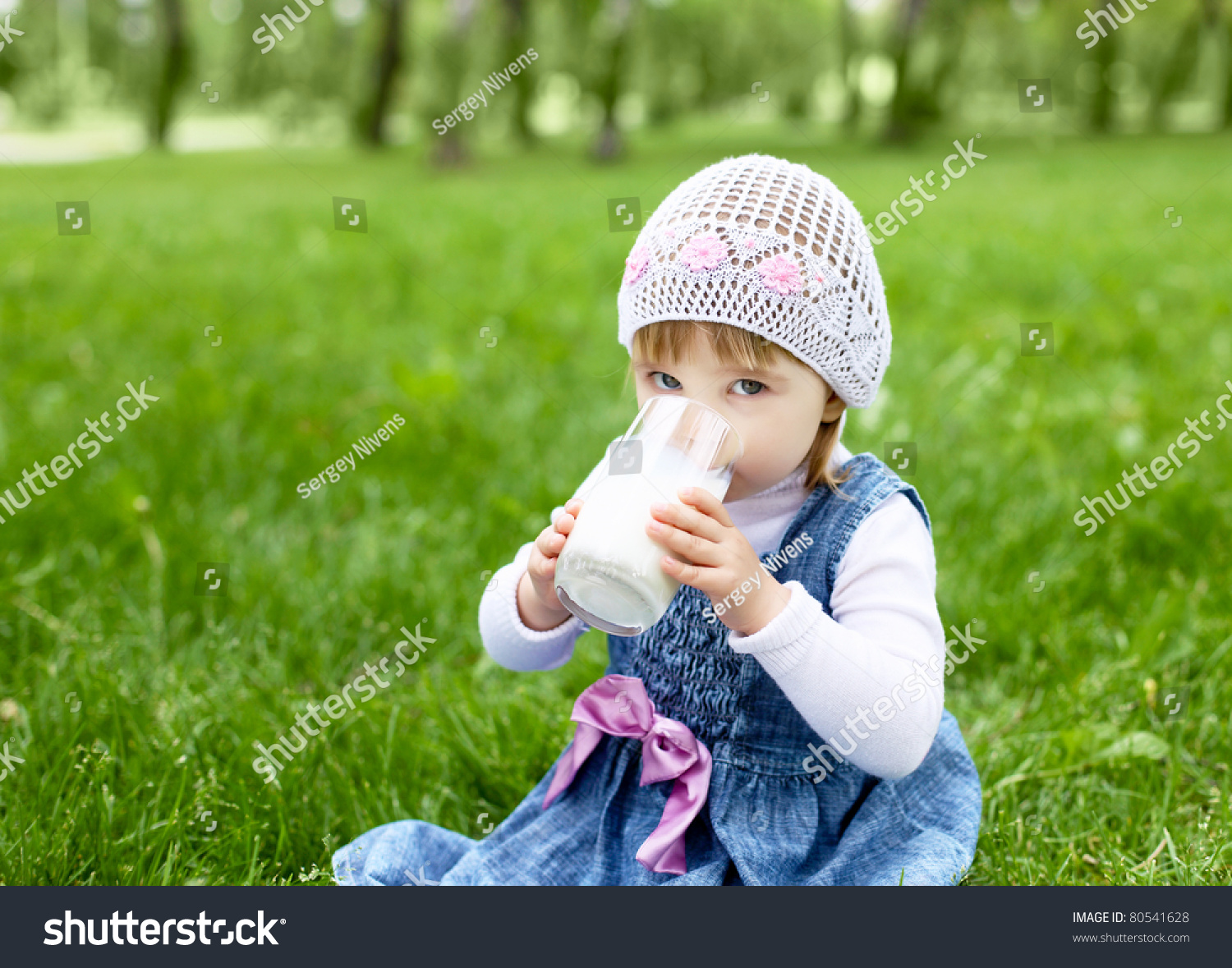 portrait-happy-little-girl-drinking-milk-stock-photo-80541628