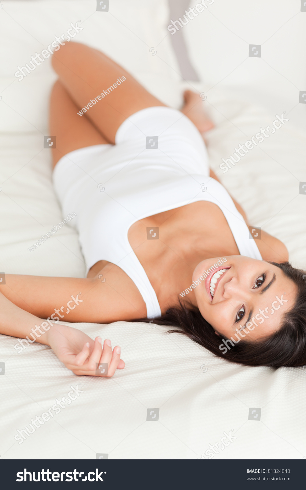 Brunette Smiling Woman Lying On Bed Stock Photo Shutterstock