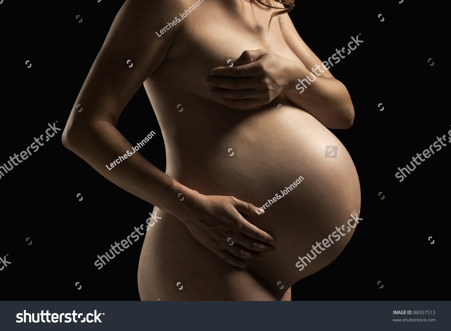 Pregnant Woman Holding On Breast Belly photo