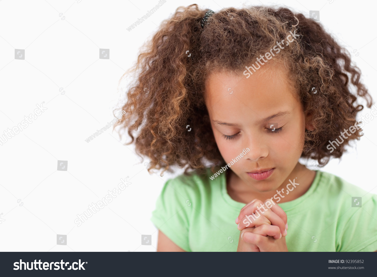 Cute Girl Praying Against White Background Stock Photo 92395852 ...