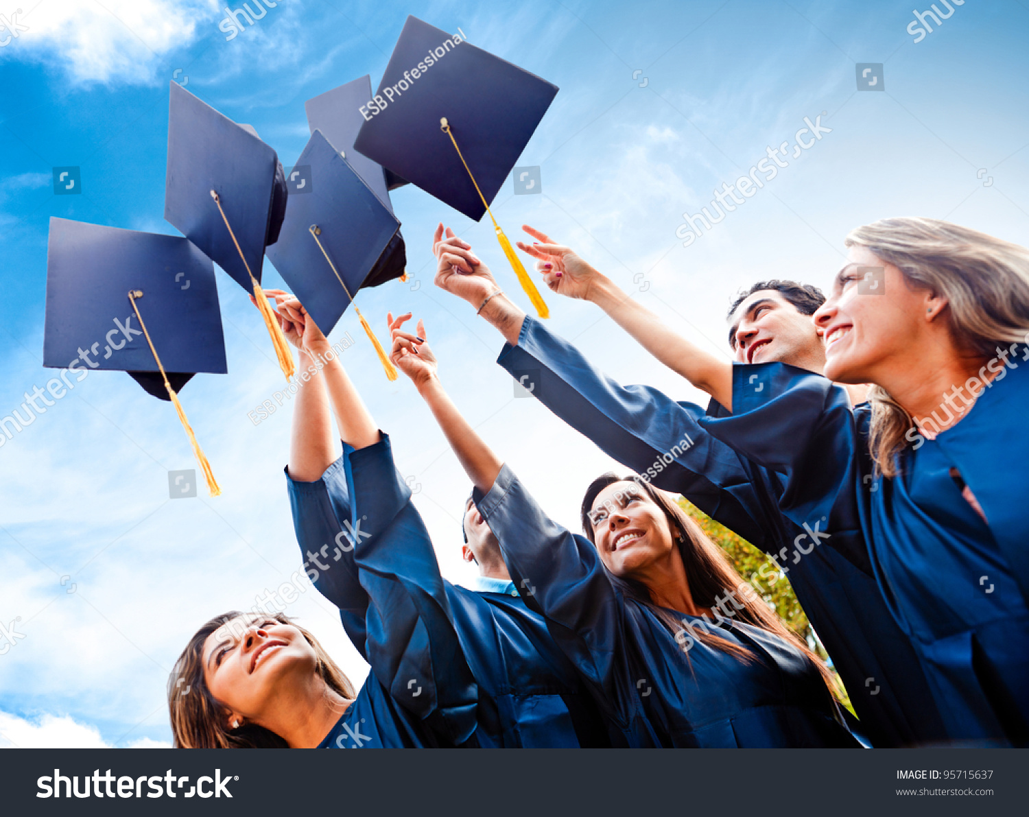 Students Throwing Graduation Hats Air Celebrating Stock Photo 95715637