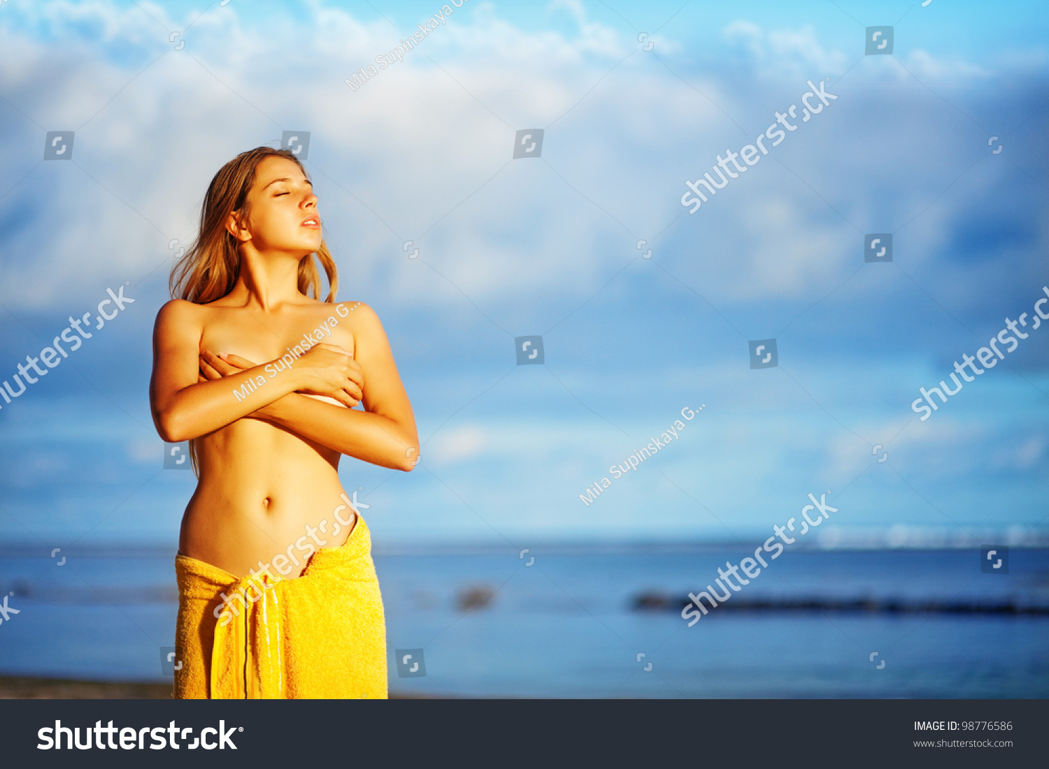 Nude Woman On Beach Stock Photo