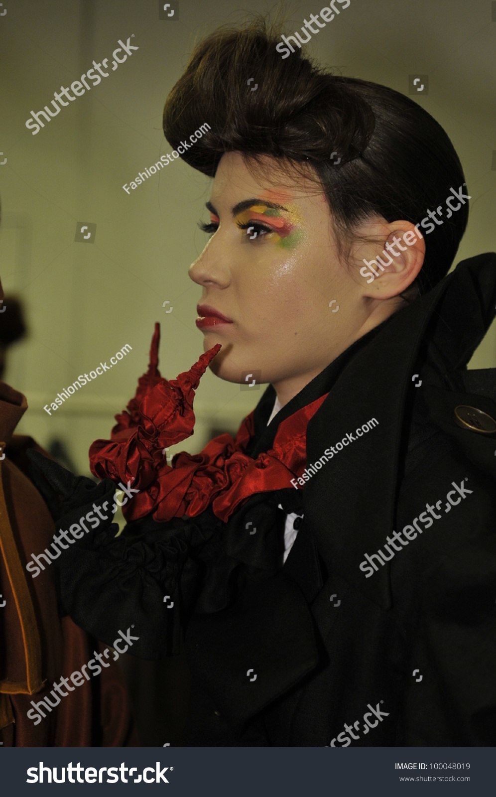 MOSCOW - MARCH 25: A model gets ready backstage at the YeZ by Yegor Zaitsev for Fall Winter 2012 presentation during MBFW on March 25, 2012 in Moscow, Russia #100048019