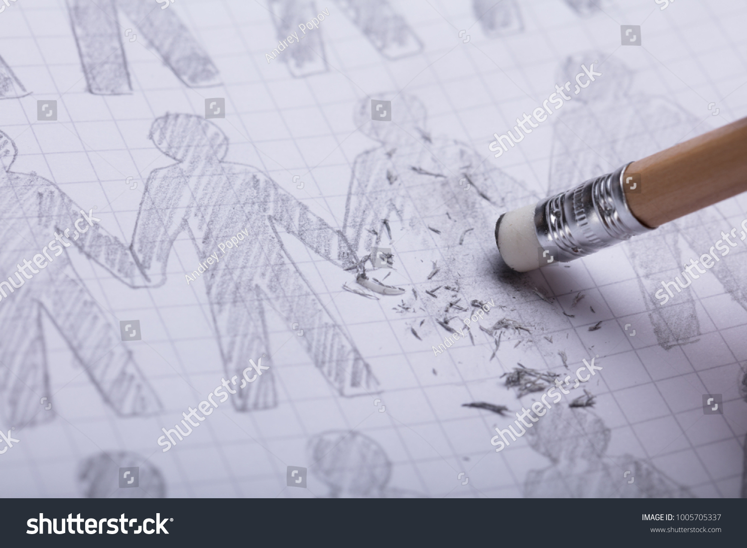 Close-up Of Pencil Eraser Erasing Drawn Figures On Paper #1005705337