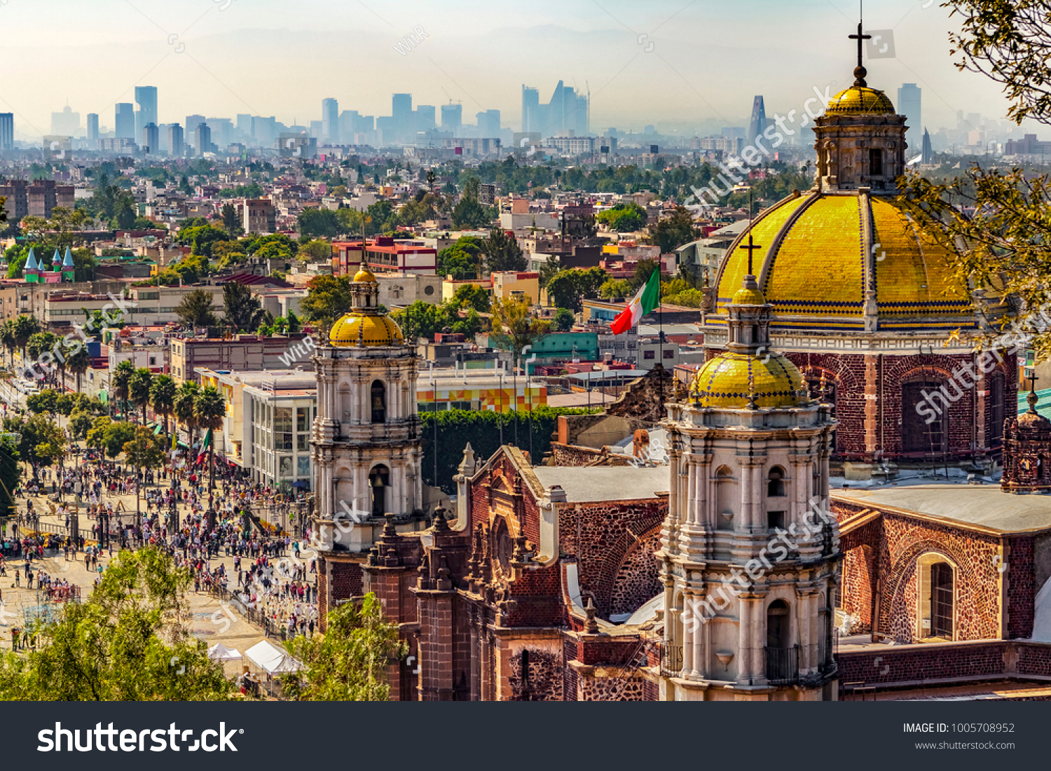 Mexico. Basilica of Our Lady of Guadalupe. Cupolas of the old basilica and cityscape of Mexico City on the far #1005708952