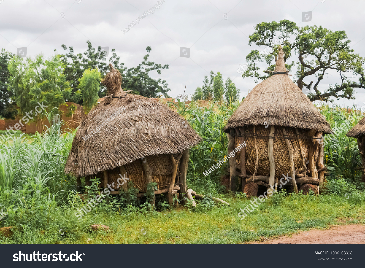 Two traditional african granaries made of wood and straw, Ouagadougou, Burkina Faso. #1006103398