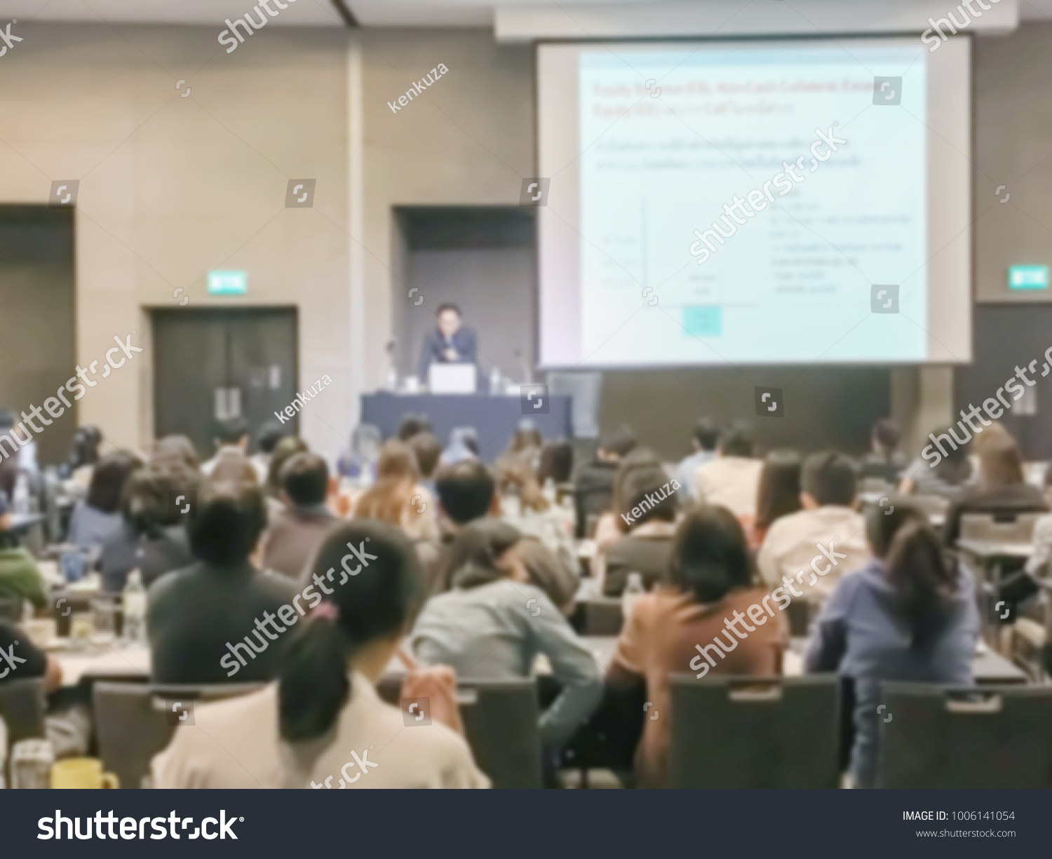 Motion blur of view of seminar with audience in a seminar room #1006141054