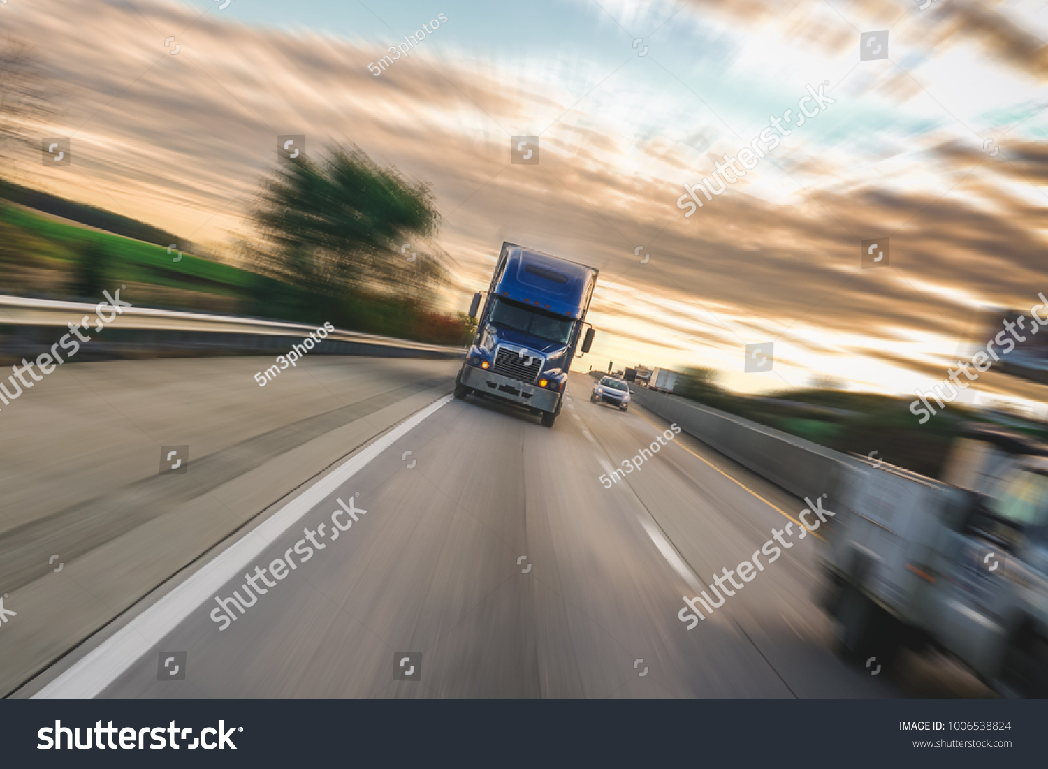 Big 18 wheeler semi truck on highway with motion blur #1006538824