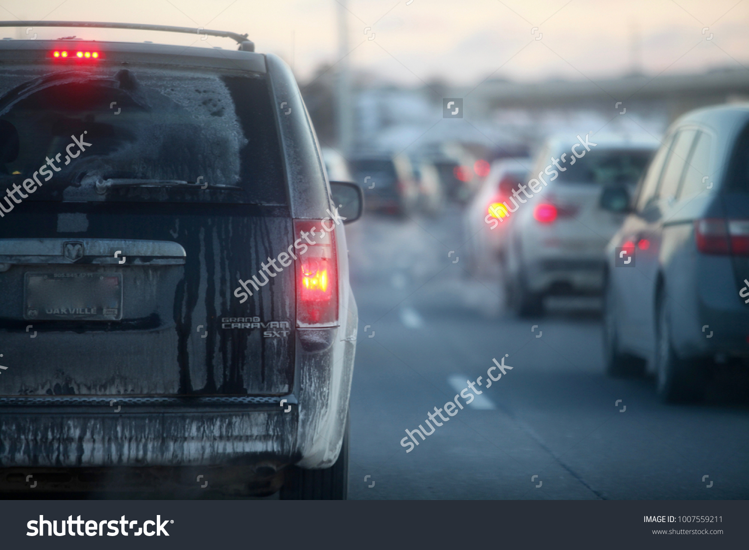 Jan 4th, 2018-Oakville, Canada: Dodge caravan waiting in traffic on the 401 highway during rush hour #1007559211