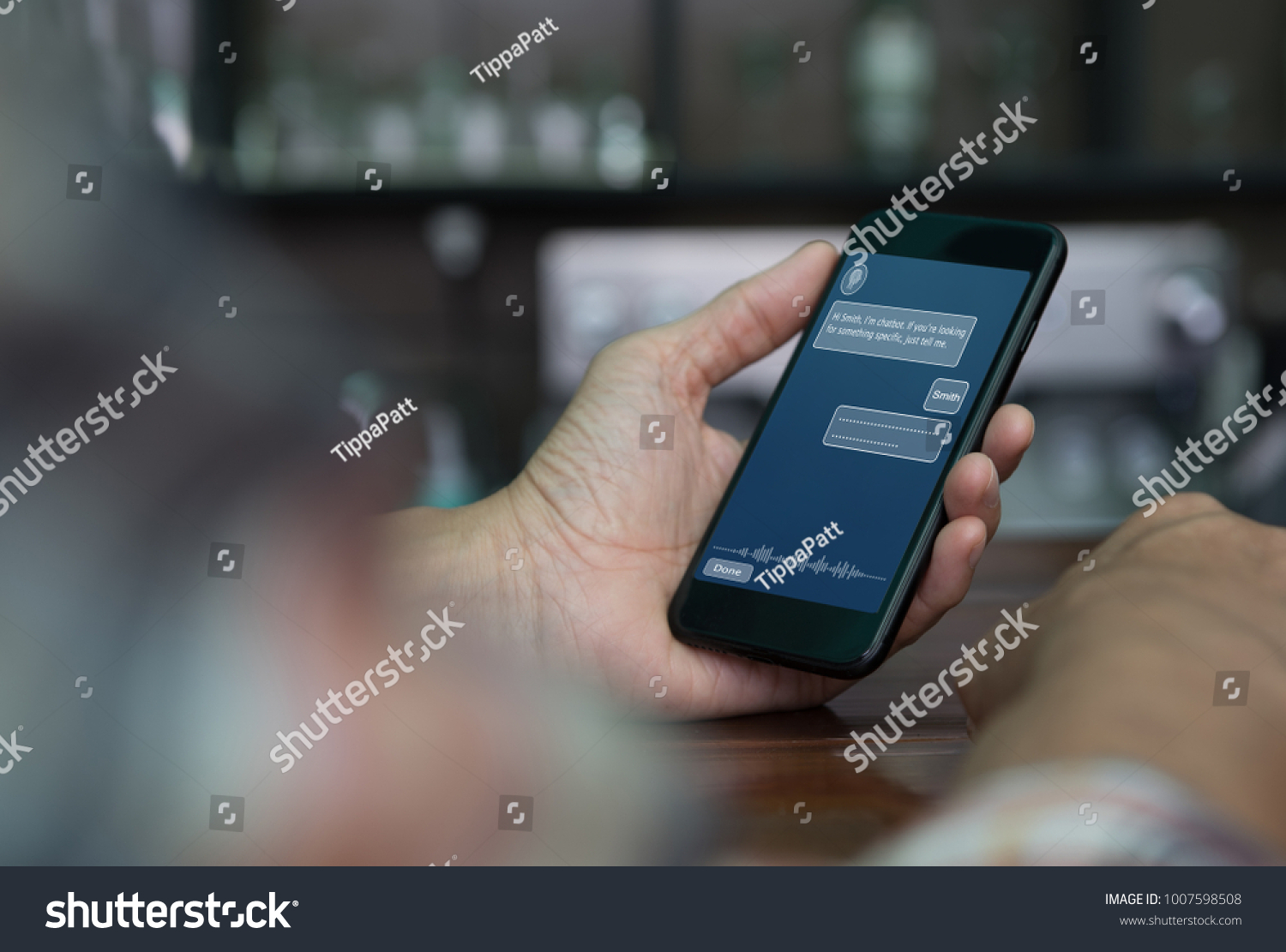  Artificial intelligence, Ai concept, casual man using mobile smart phone with chatbot application on screen in coffee shop, chat bot, social media, internet network communication #1007598508