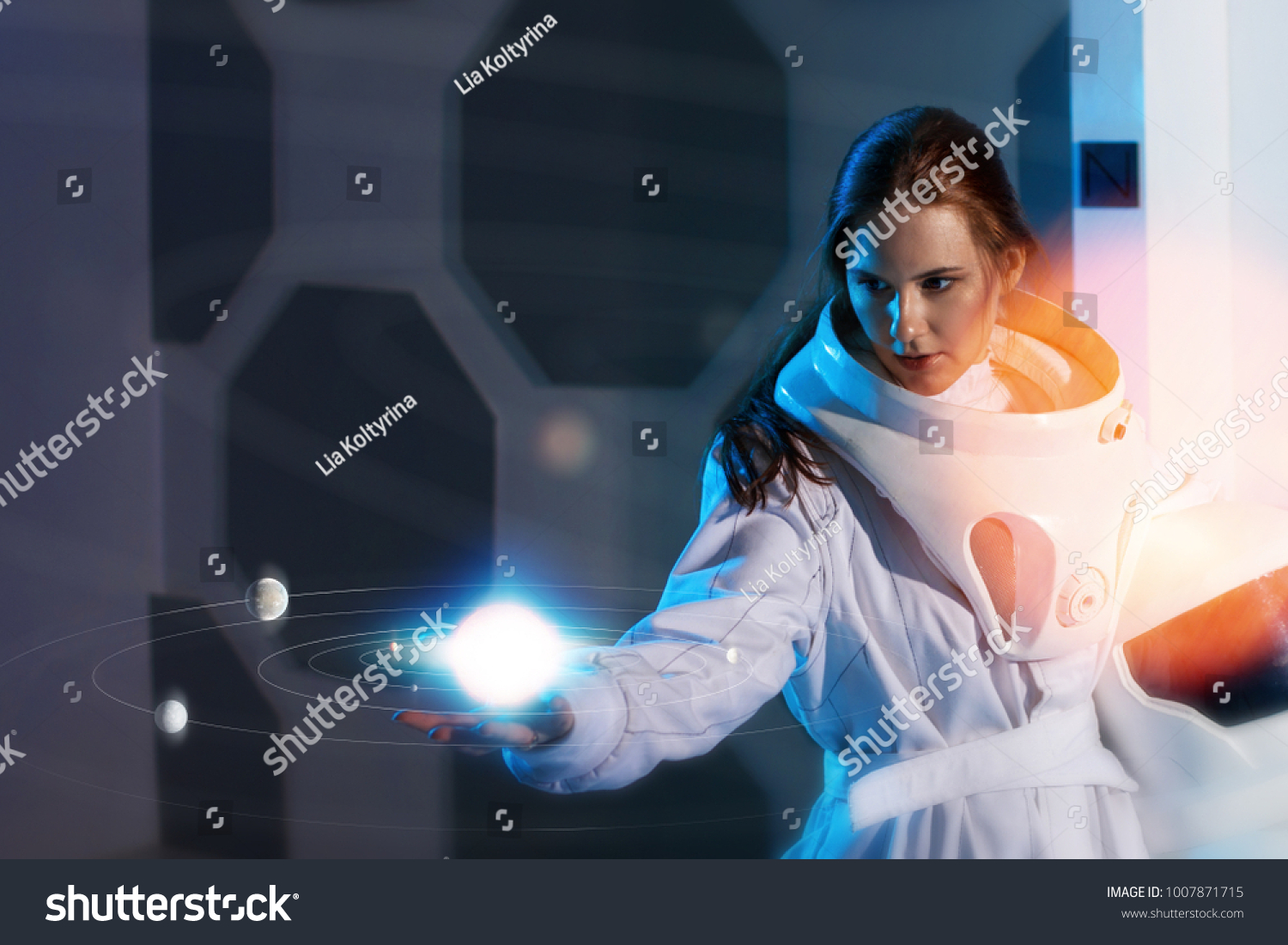 Portrait of a woman astronaut in a space suit, dreamy look up #1007871715