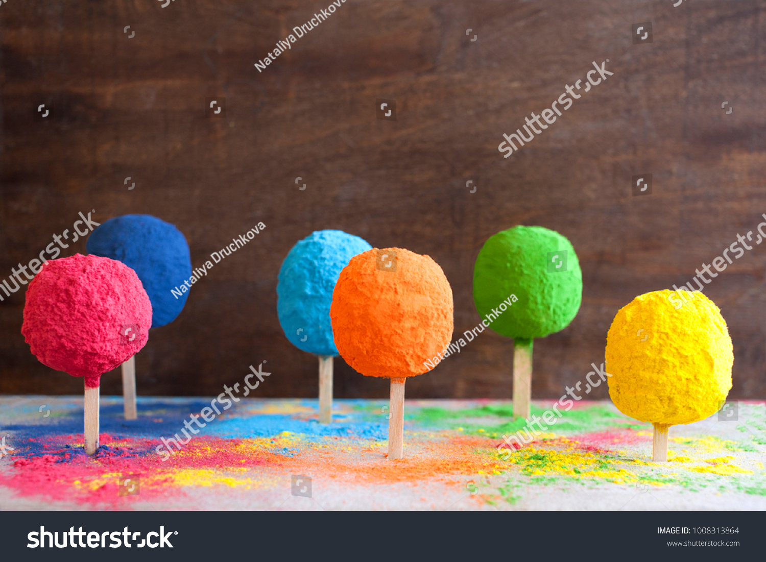 Bright colours in shapes of trees or posicles for Indian holi festival. Colorful gulal (powder colors) for Happy Holi. #1008313864