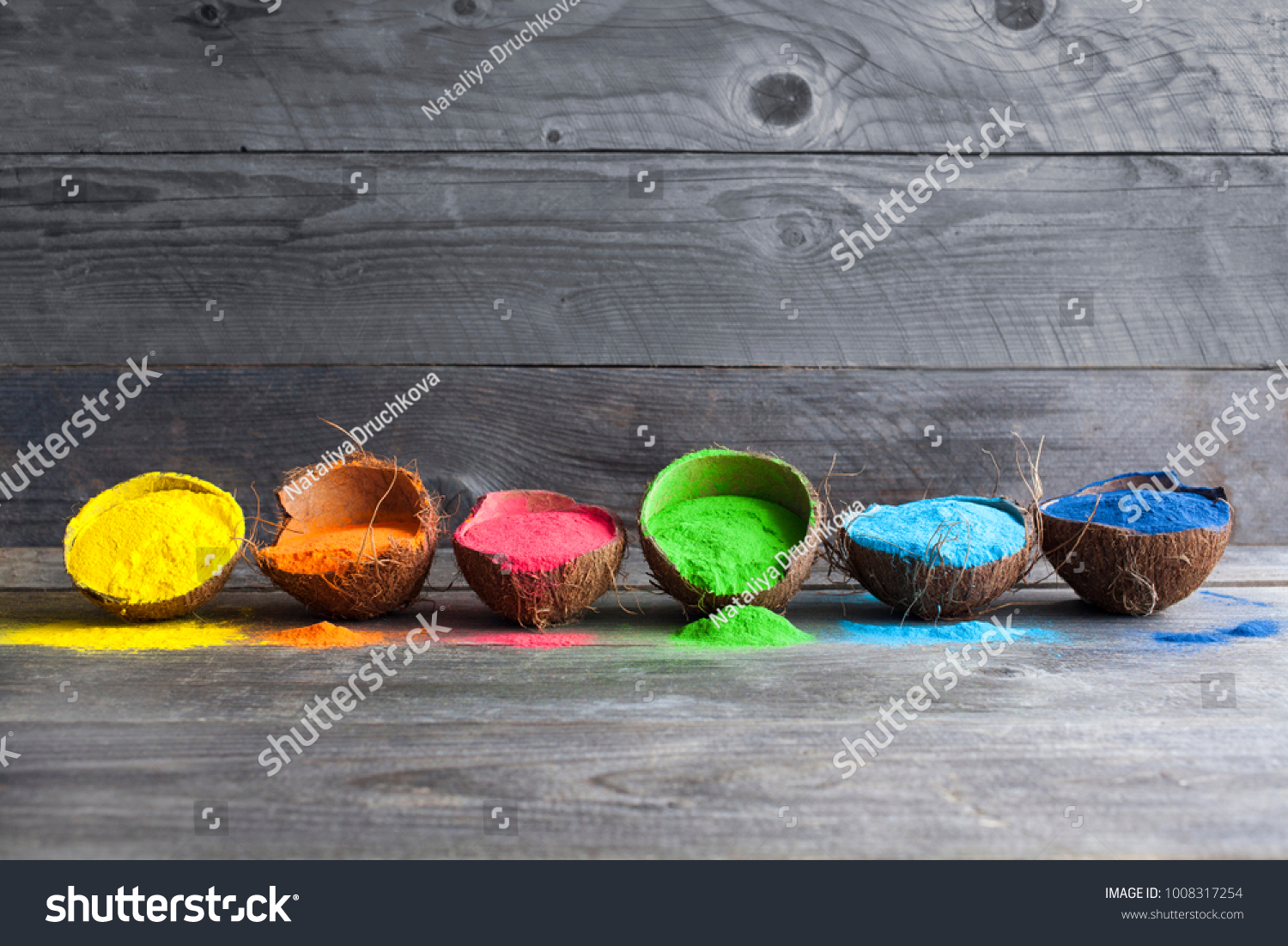 Bright colours in coconut shells for Indian holi festival. Colorful gulal (powder colors) for Happy Holi. #1008317254