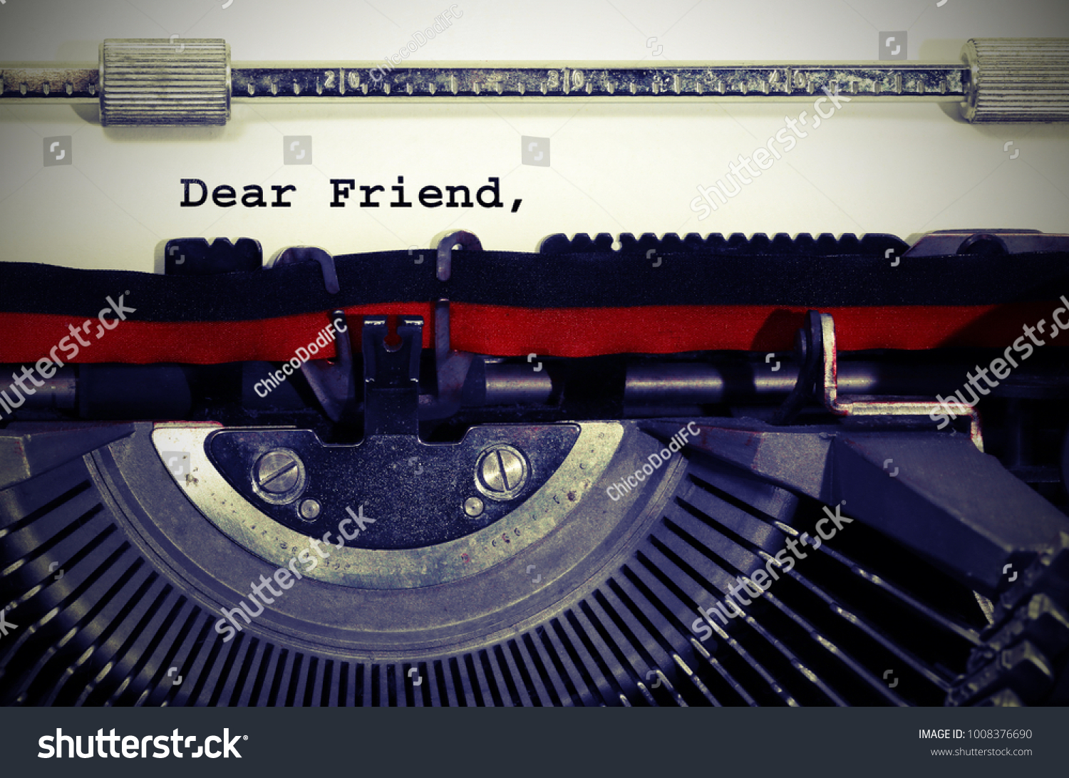 Text Dear Friend written with the typewriter on white sheet #1008376690