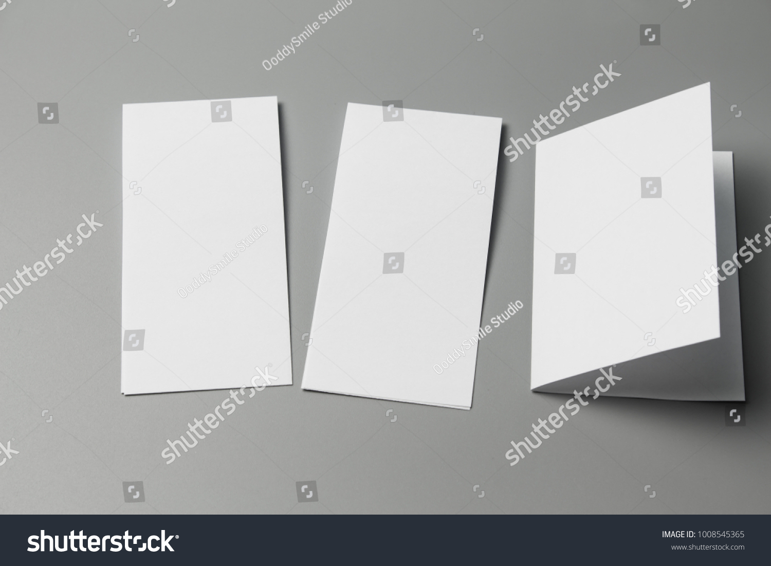 Blank portrait Mock-up paper. changeable background / white paper isolated on gray. identity design, corporate templates, company style, set of booklets, blank white folding paper flyer #1008545365
