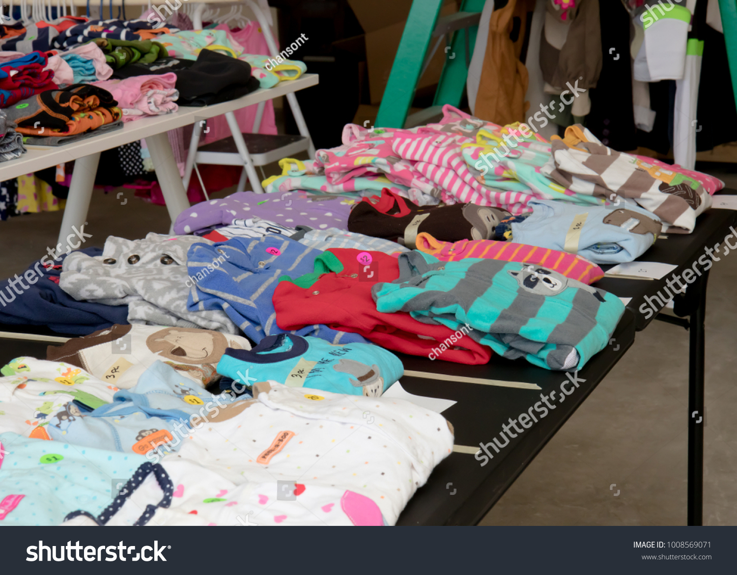 Colorful children's pajamas a suburban yard sale #1008569071
