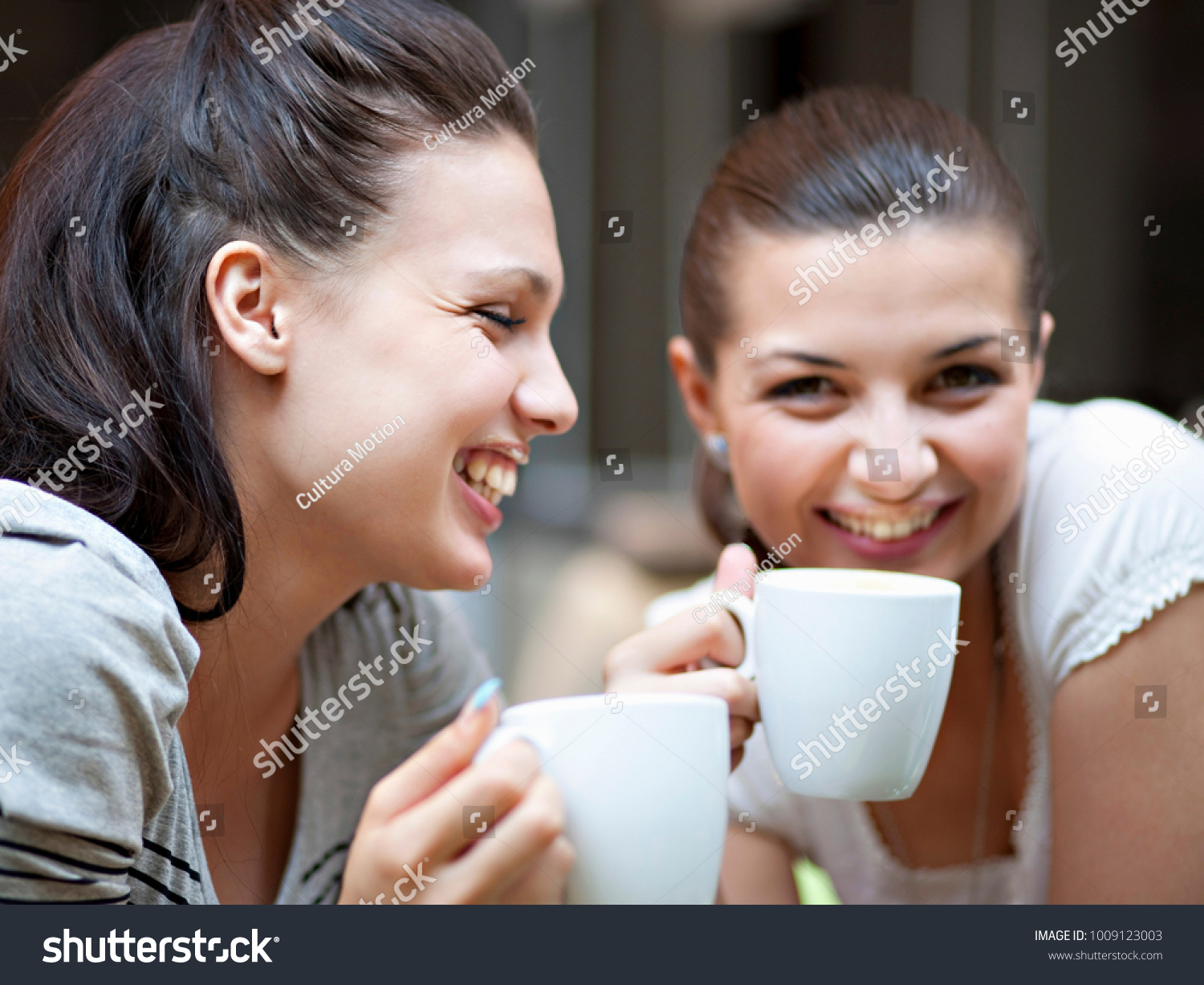 Young women having coffee #1009123003