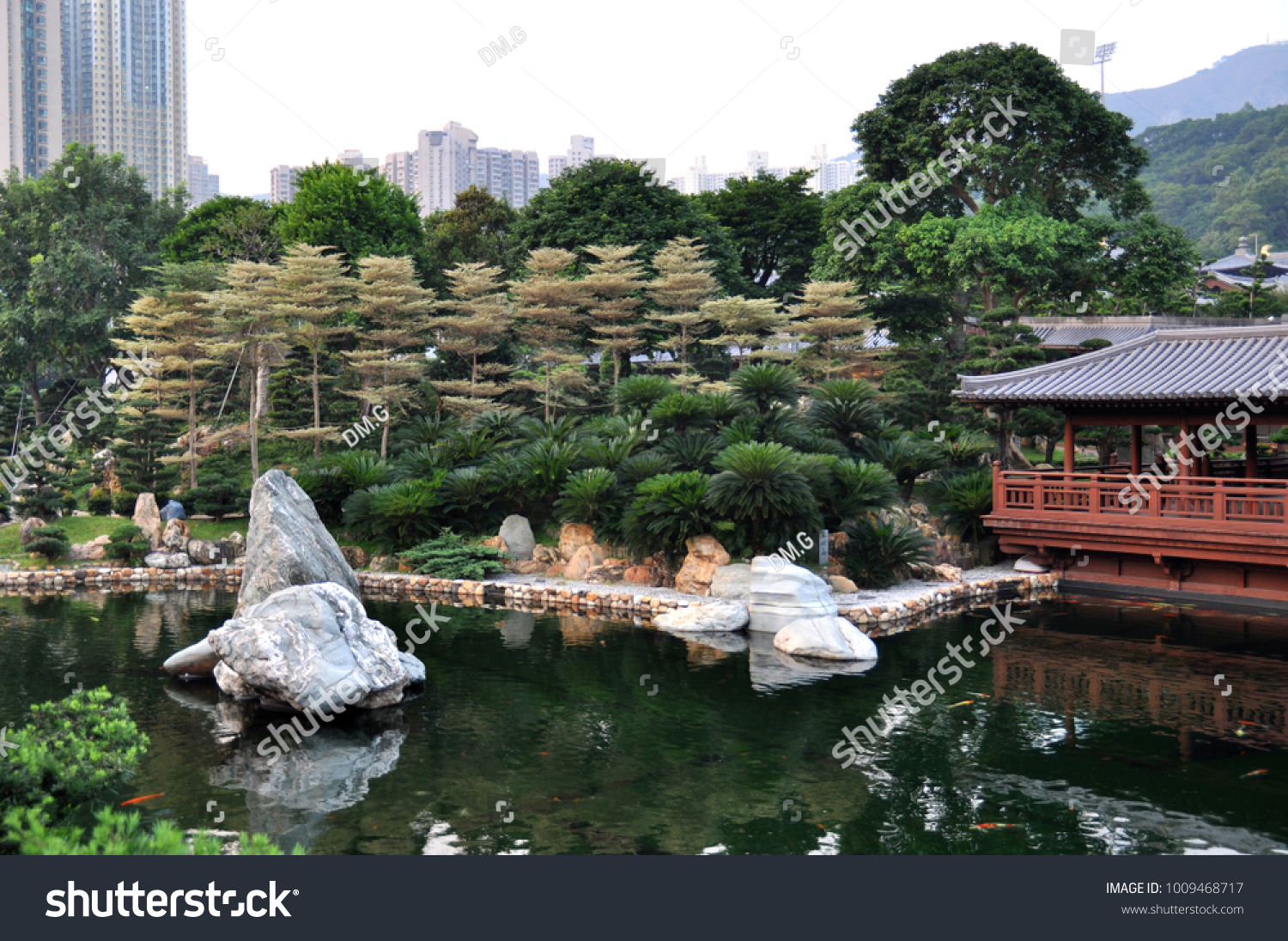 Lake and large stones in the botanical garden of Hong Kong #1009468717