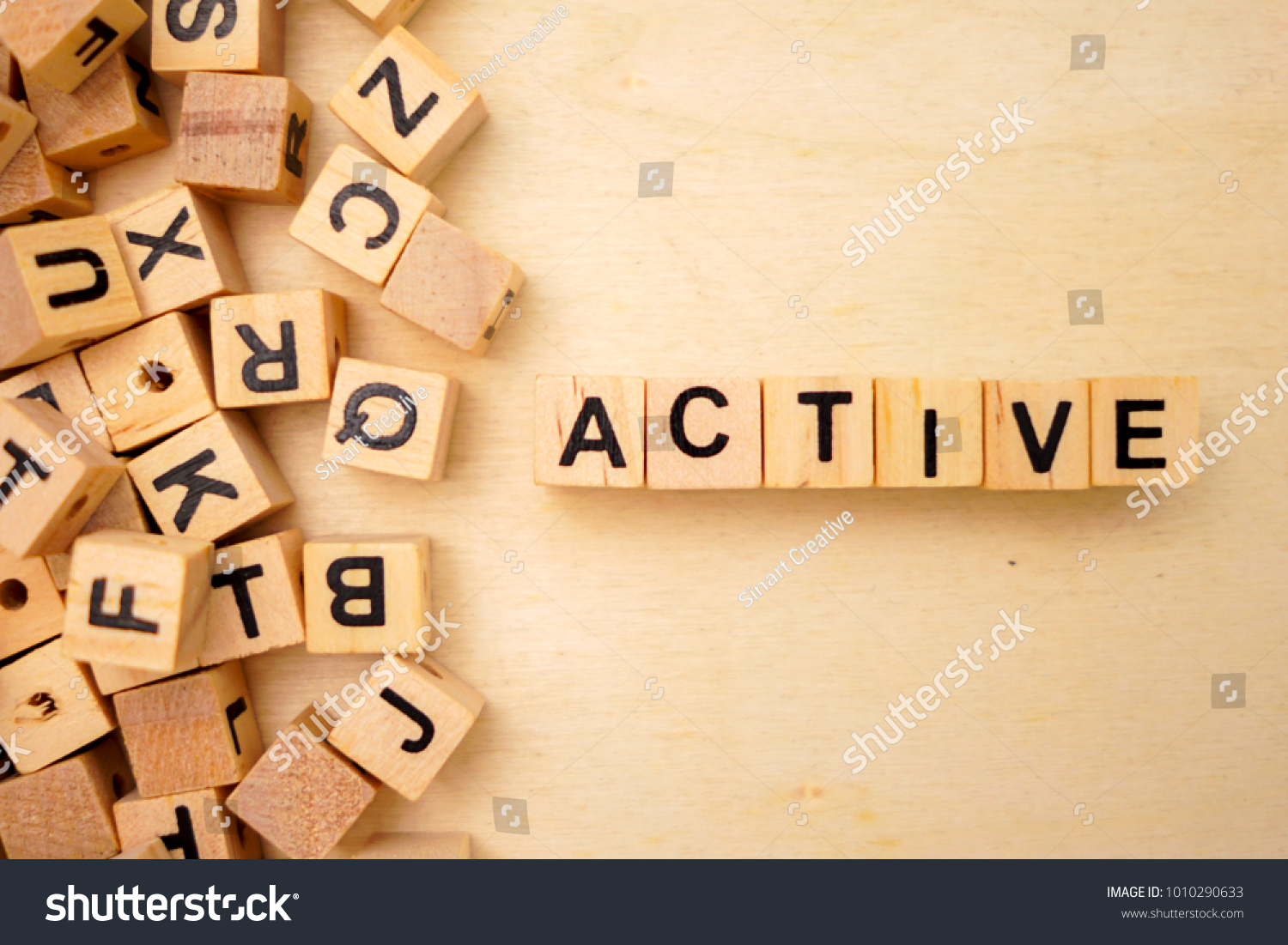 Active word cube on wood background #1010290633