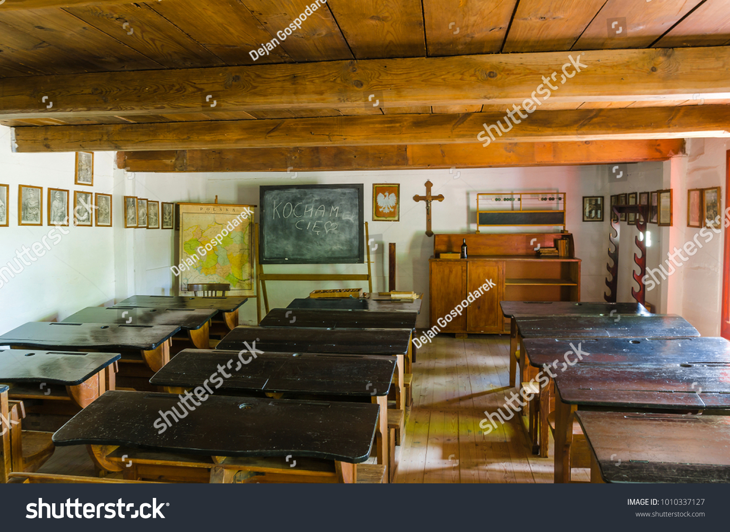 Maurzyce/Poland - June 15, 2015. Interior of a classroom located in the wooden cottage in the open-air museum in Maurzyce, Poland #1010337127